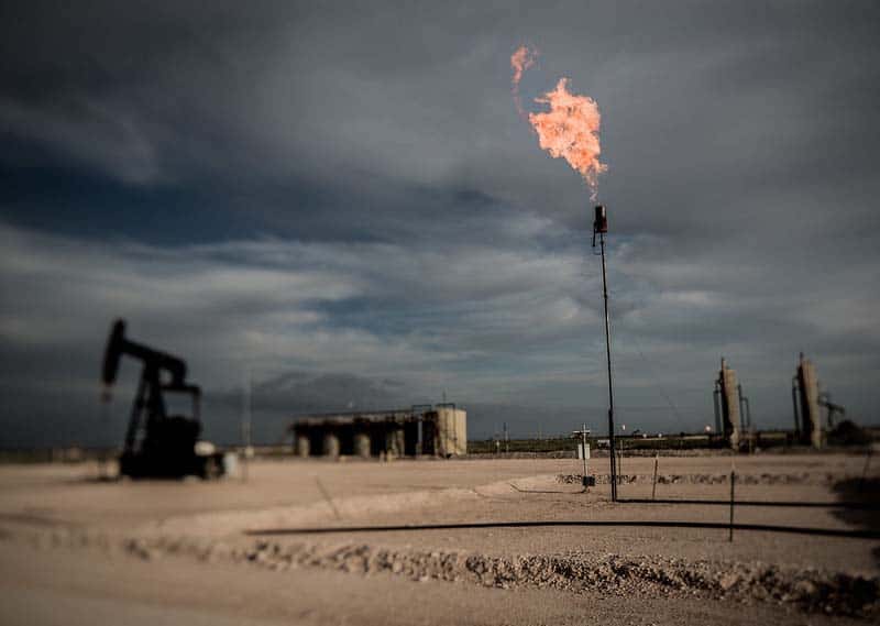 A Permian Basin oil field in Eddy County, New Mexico. A major source of VOC pollution is oilfield the burning of excess gas for safety reasons.