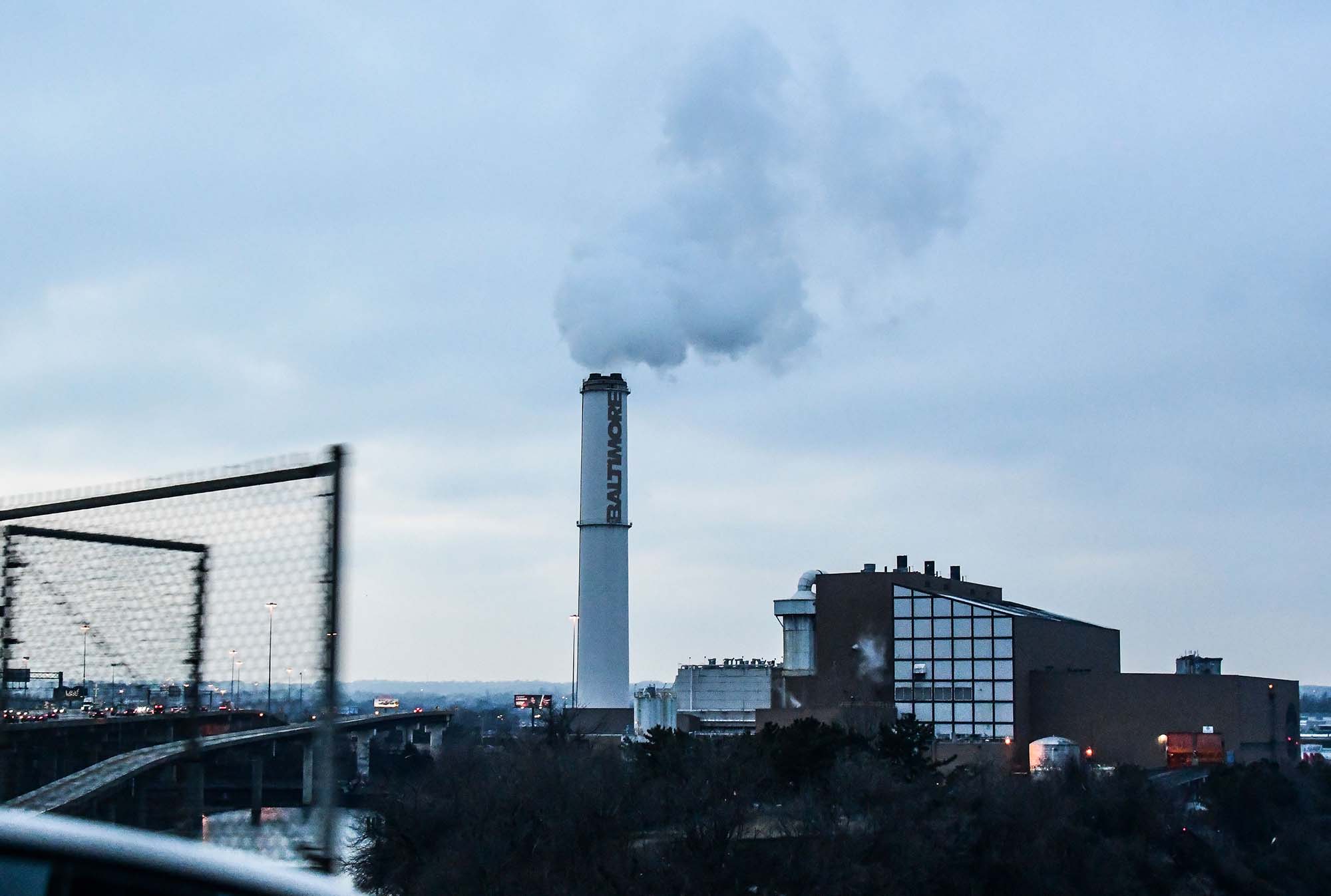 The smokestack of the Wheelabrator Incinerator is seen in Baltimore. Environmental justice is at a turning point.
