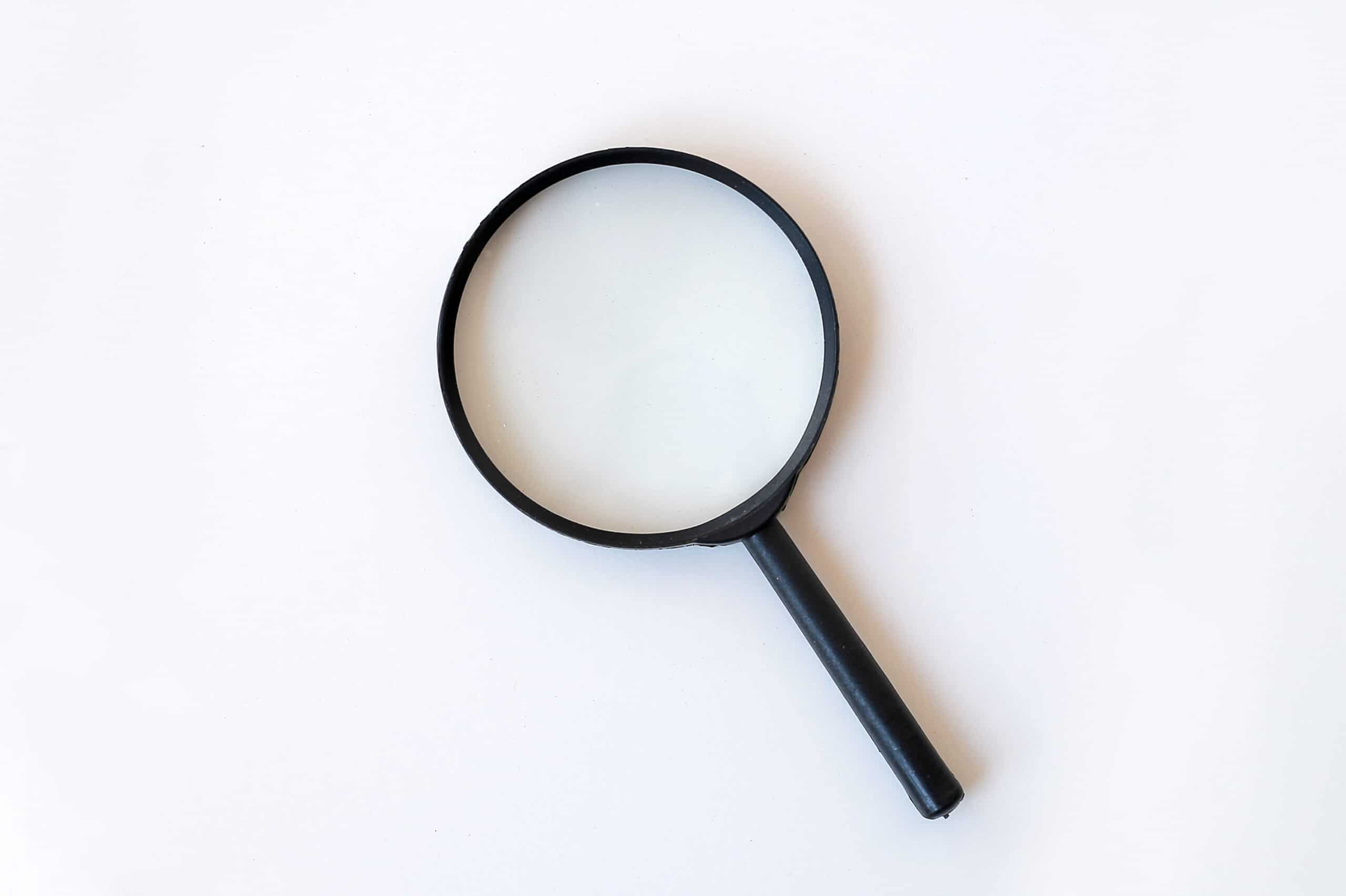 A magnifying glass on a white background.