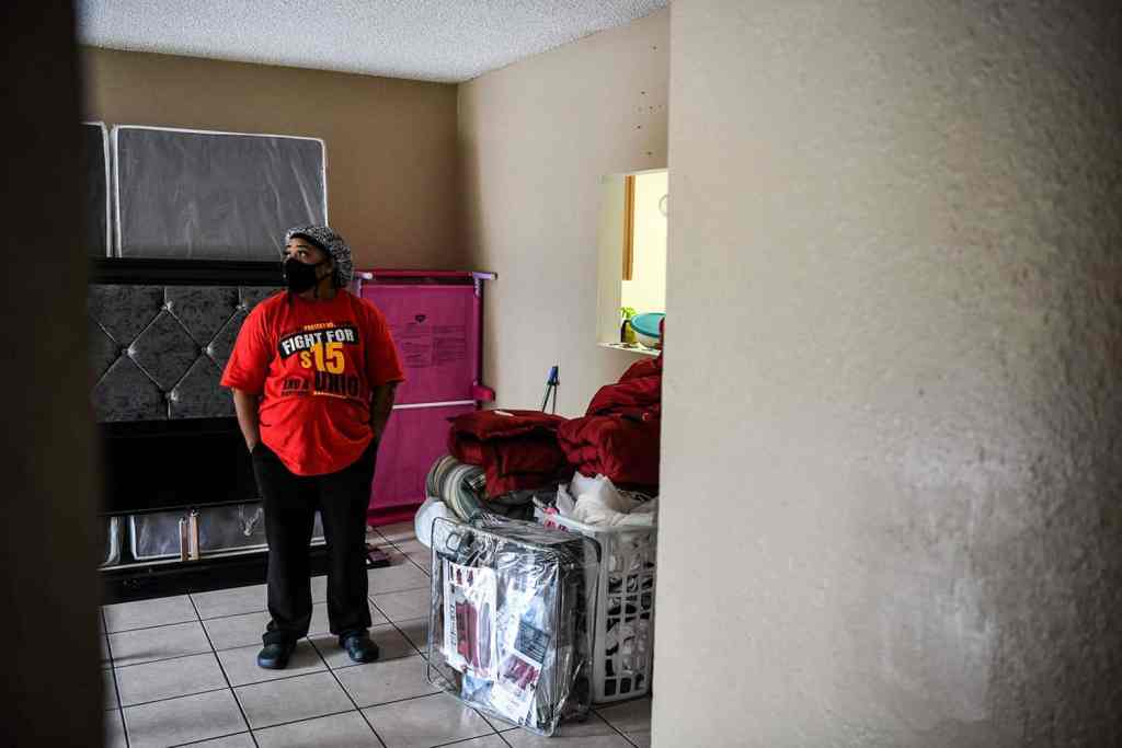 Deatrice Edie keeps her home's belongings, including clothes and mattress, packed by the door.