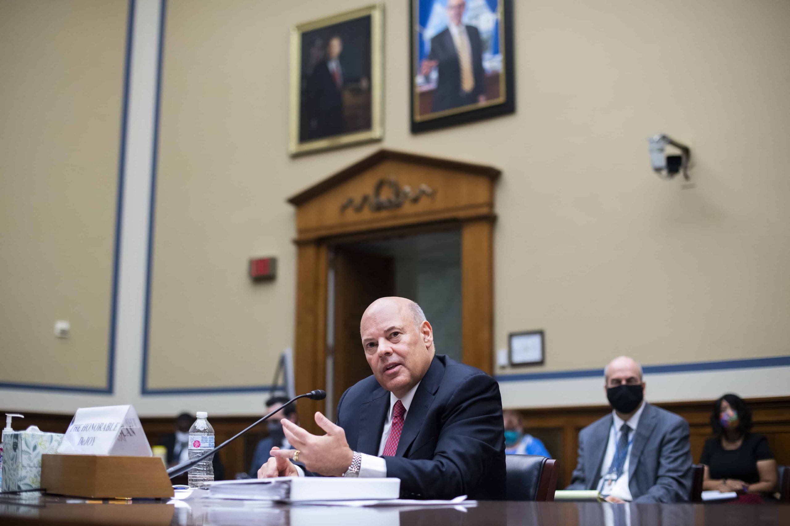 Louis DeJoy testifies during a hearing before a House committee.