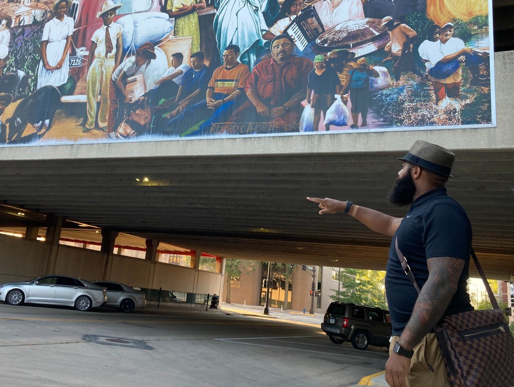 Matthew Gilbert, an attorney, points to the former location of his great-grandfather's savings and loan.