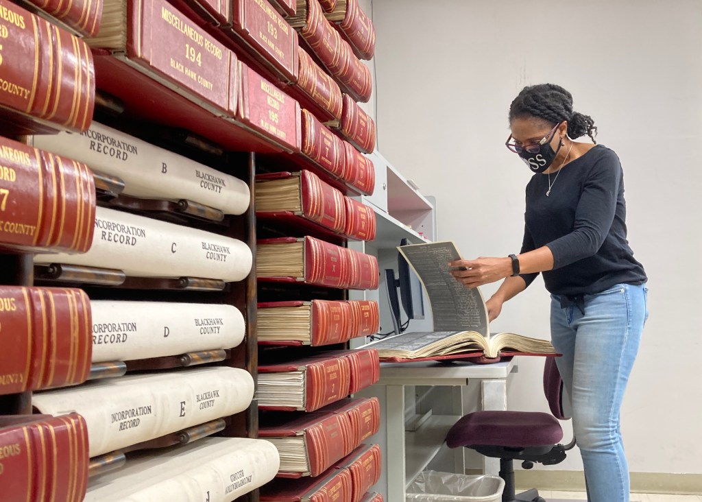 ReShonda Young looks at the restrictive covenant placed on homes in her neighborhood, including hers, that prevented Black residents from moving in.