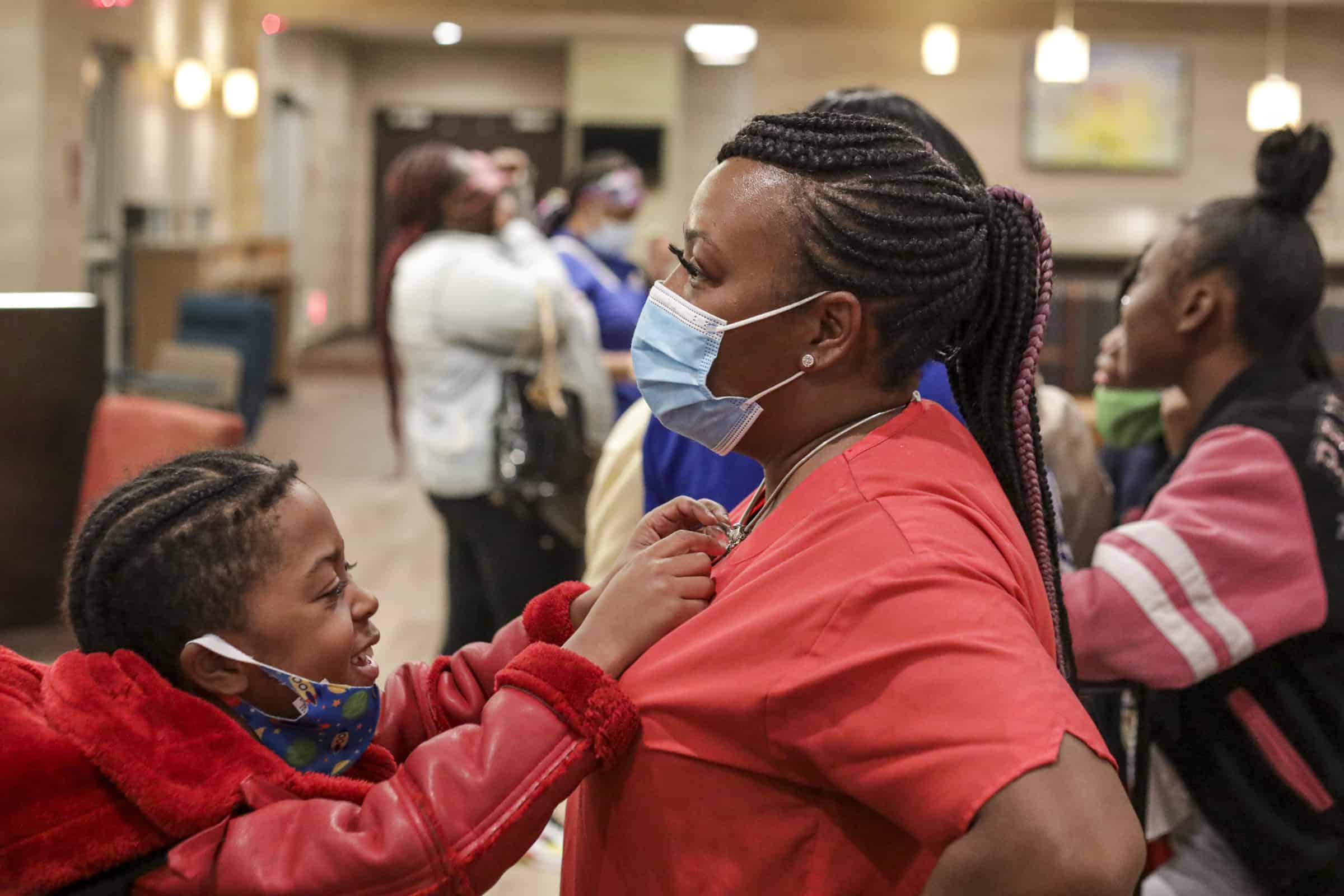 Jayceon Shelton, 8, tries to convince mom Reshicka Upshaw to get him a toy