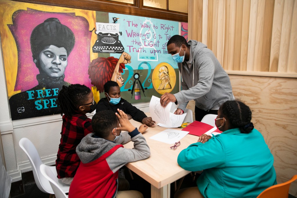 Joel Riley III teaches students at the 1619 Freedom School.