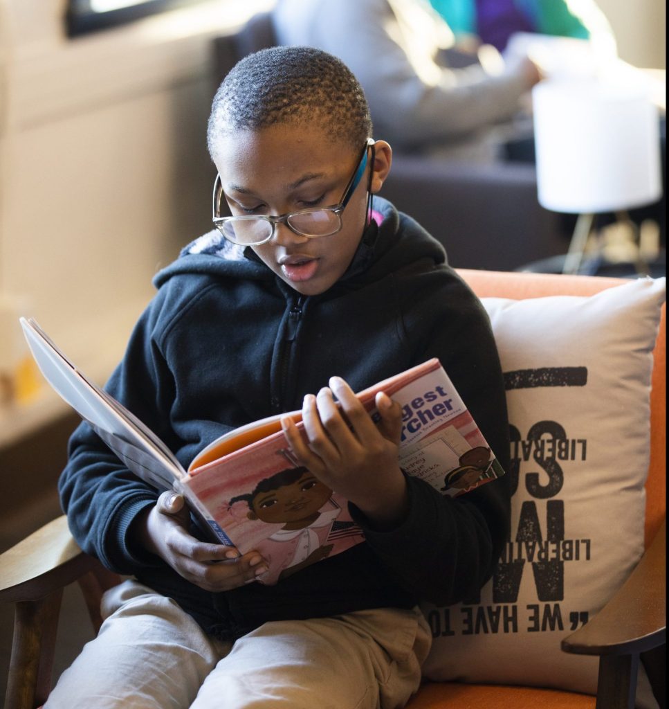 Amouri Johnson, 10, reads at the 1619 Freedom School.