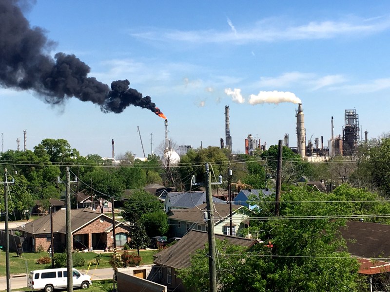 Smoke from a Houston refinery billows into the surrounding neighborhoods.