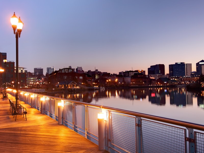 The Wilmington skyline is visible against a dusky sky.