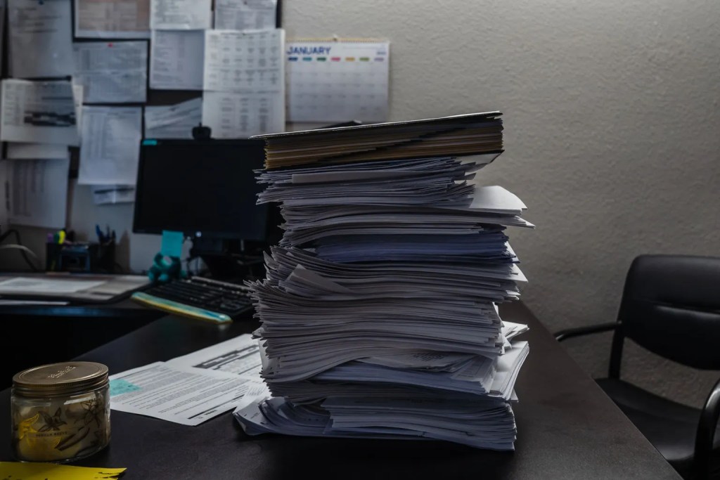 A portion of a stack of 2022 phone screens sit on the desk of Program Manager Darlene Jackson at the McAlister Institute's Adult Detox in Lemon Grove.