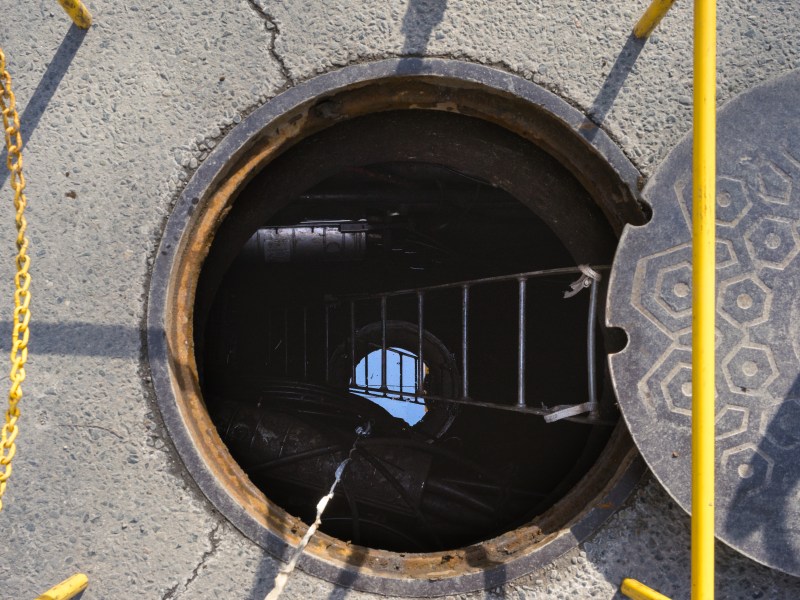 An open manhole on a city street